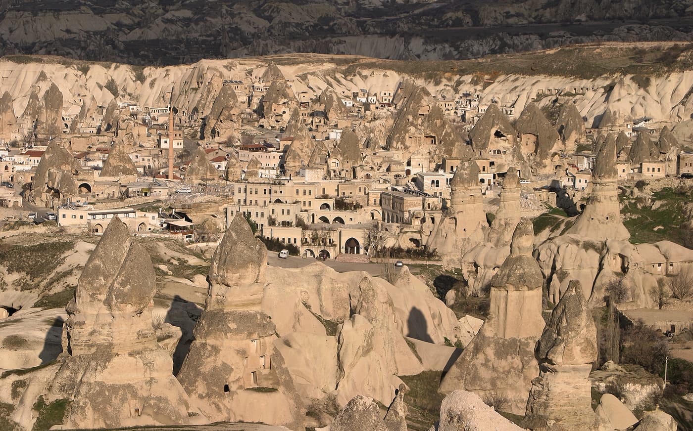 Rock dwellings carved into the pale cliffs of the Göreme valley in Cappadocia.